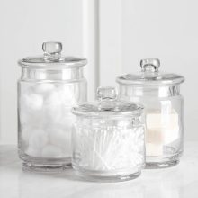 Clear glass apothecary jars set of 3 – small, medium, and large canisters for bathroom and beauty storage.