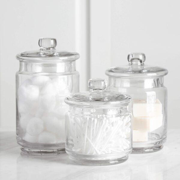 Clear glass apothecary jars set of 3 – small, medium, and large canisters for bathroom and beauty storage.