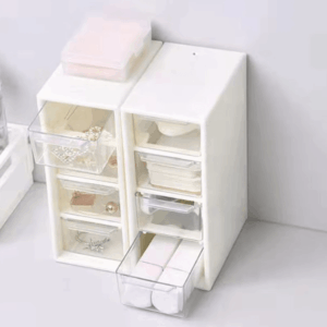 Compact plastic storage box with 4 drawers, ideal for organizing office supplies, makeup, or small items, perfect for desk or vanity use.