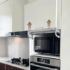 Hydraulic flip-up door support system for kitchen cabinets, ensuring smooth operation and easy access.