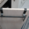 Stainless steel over-cabinet towel rack for kitchen and bathroom storage, featuring a sleek design and easy punch-free installation. 