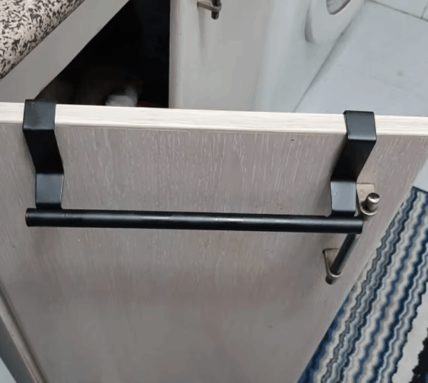 Stainless steel over-cabinet towel rack for kitchen and bathroom storage, featuring a sleek design and easy punch-free installation. 
