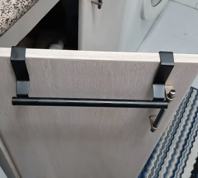 Stainless steel over-cabinet towel rack for kitchen and bathroom storage, featuring a sleek design and easy punch-free installation. 