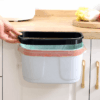 Wall-mounted kitchen compost bin with a sliding cover, perfect for cabinet doors or under-sink installation, offering easy waste disposal and odor control.