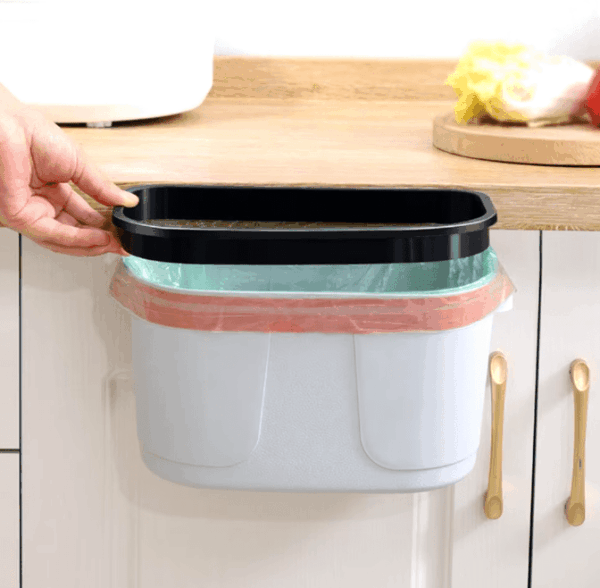Wall-mounted kitchen compost bin with a sliding cover, perfect for cabinet doors or under-sink installation, offering easy waste disposal and odor control.