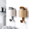 Wall-mounted squirrel hook with hidden squirrel that pops out, designed for holding keys, hats, and accessories in a playful and functional way. 