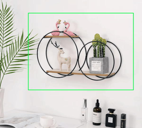 Nordic circular wall shelf in black with wooden base, holding decorative candles and plants. 