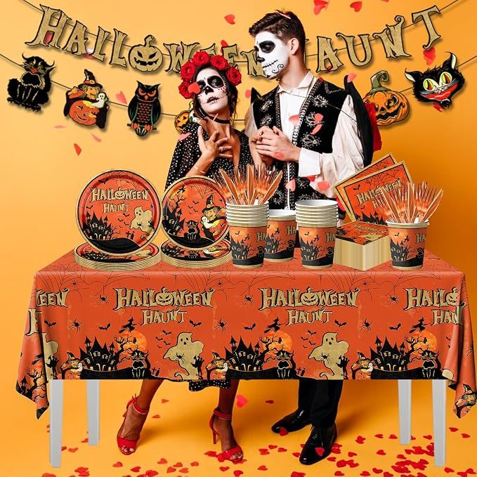 Vintage Halloween Buffet Table with Themed Tableware and Party Couple